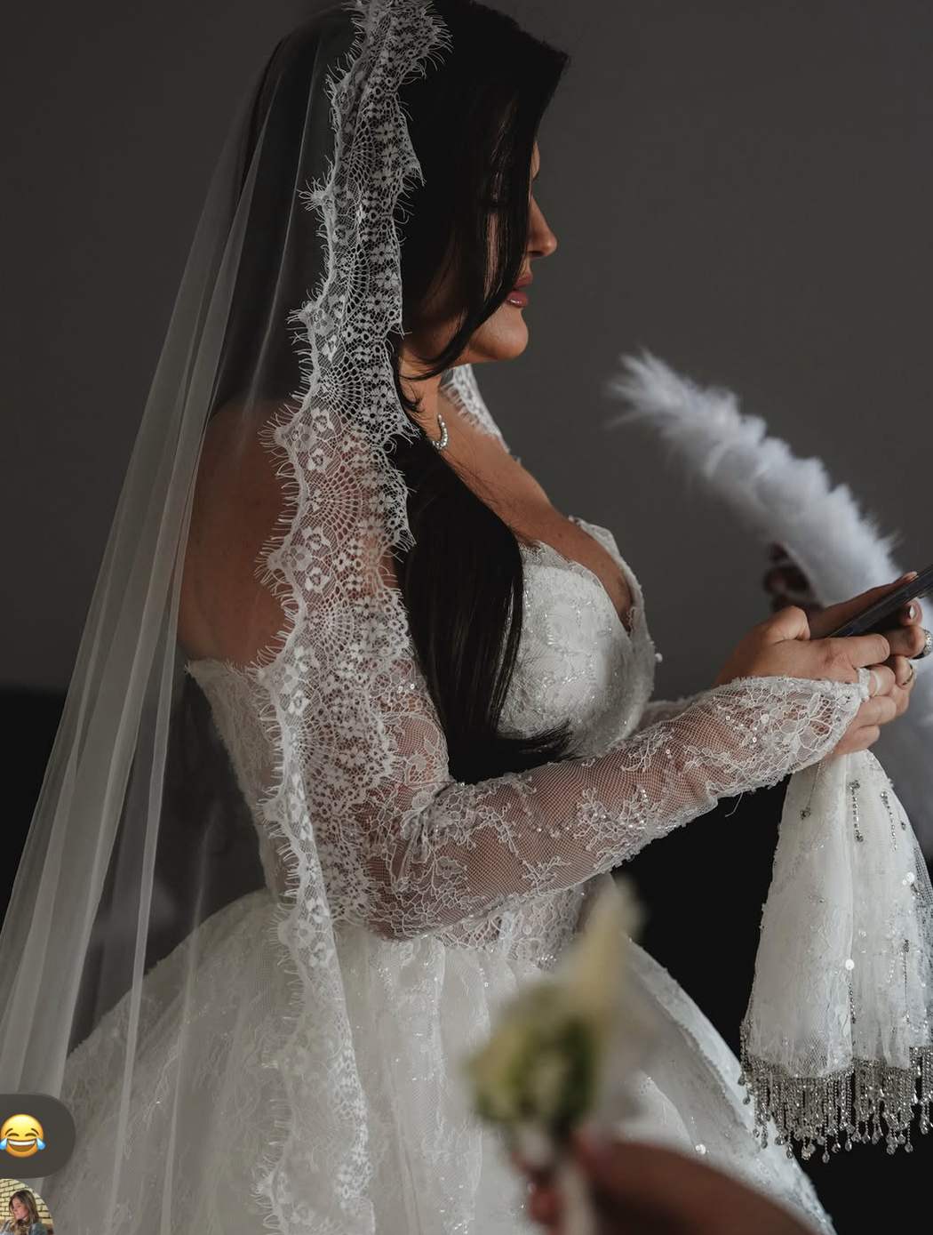 Bride in profile wearing a lace veil