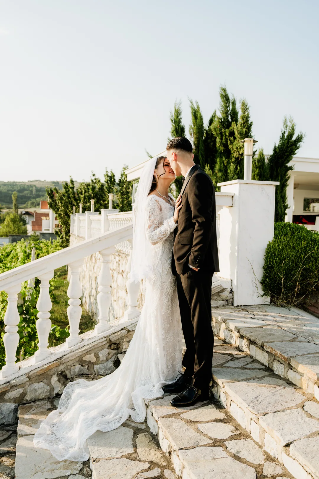Couple about to kiss on the balustrade steps